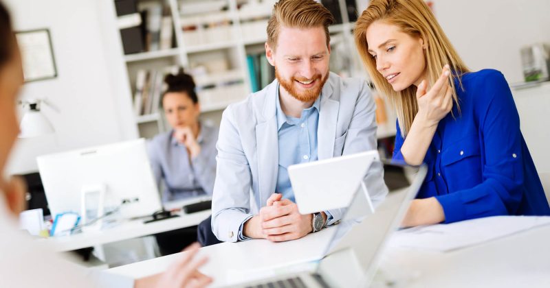 group-of-business-people-working-as-team-in-office-TRCKLYU.jpg